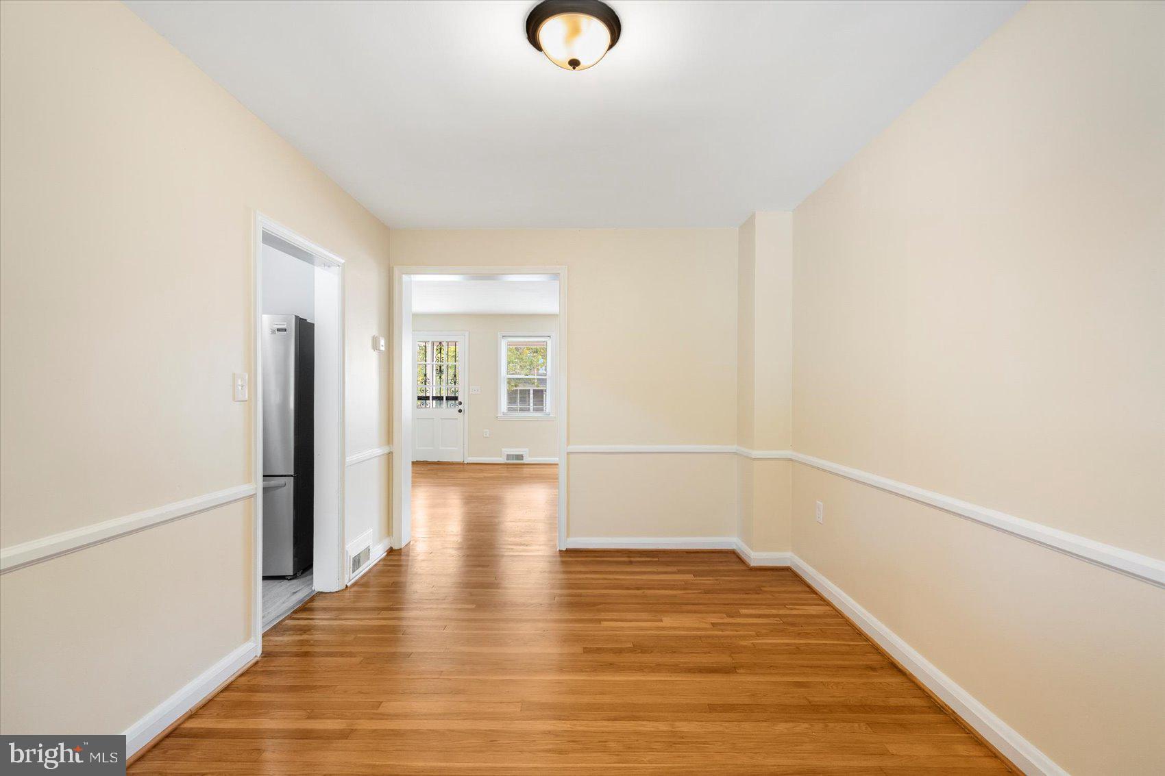 1444 Meridene Drive Baltimore, MD 21239 - Photo 12 of 36 a view of livingroom with hardwood floor and window