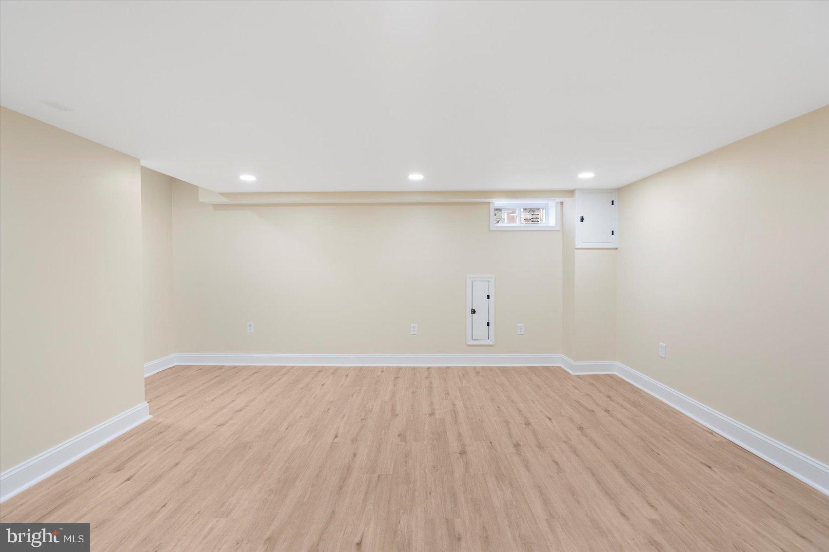 1444 Meridene Drive Baltimore, MD 21239 - Photo 19 of 36 a view of an empty room with wooden floor