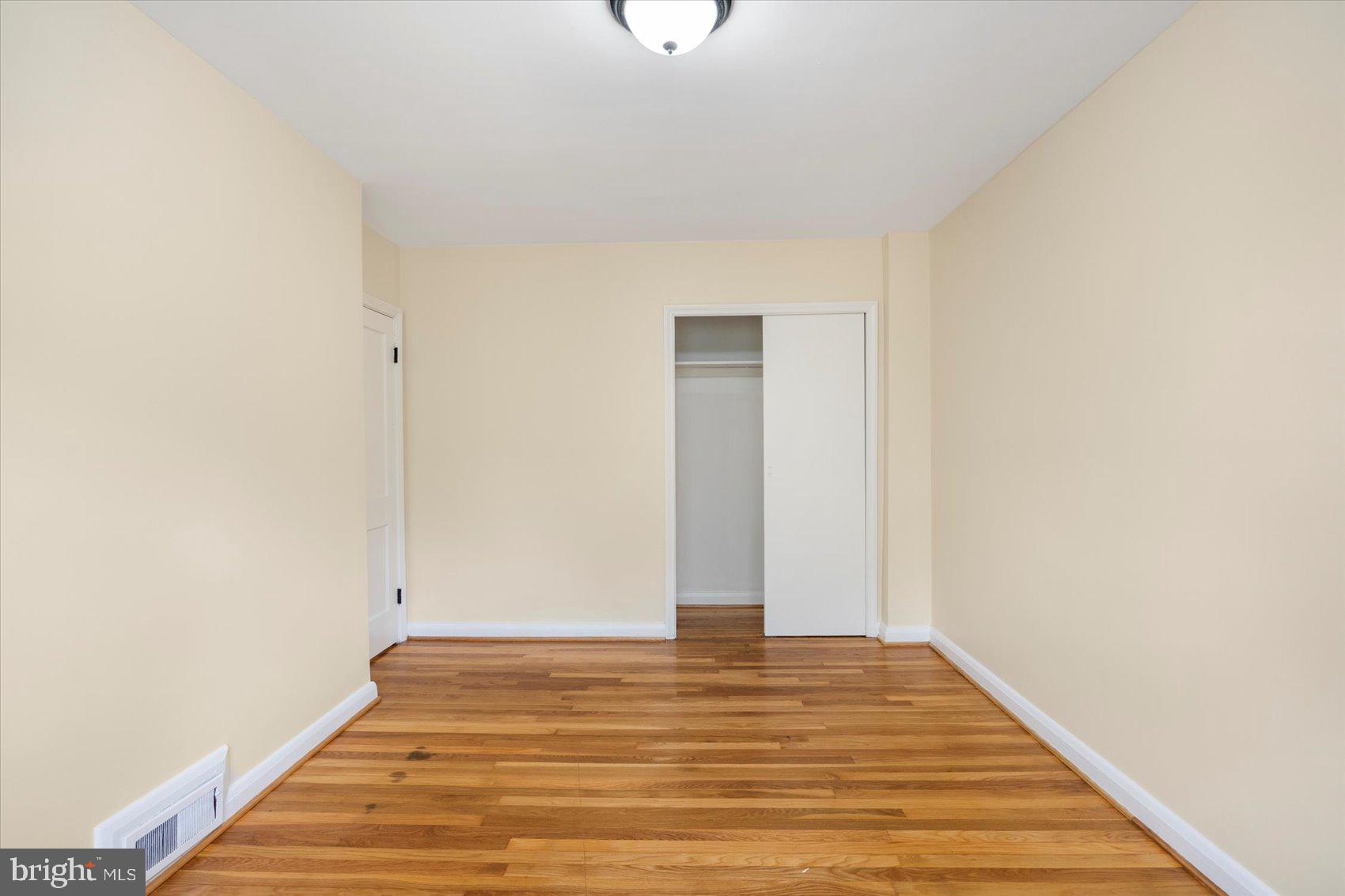1444 Meridene Drive Baltimore, MD 21239 - Photo 21 of 36 a view of room with wooden floor
