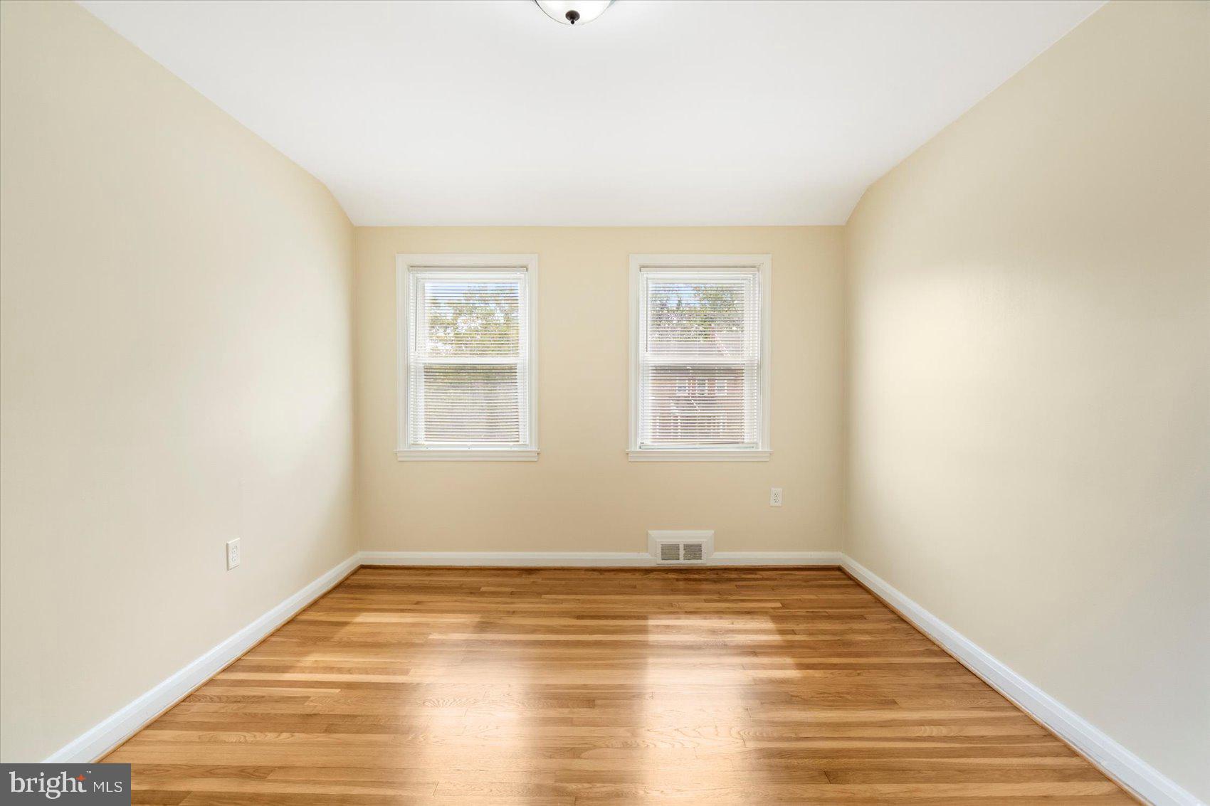 1444 Meridene Drive Baltimore, MD 21239 - Photo 26 of 36 a view of empty room with wooden floor