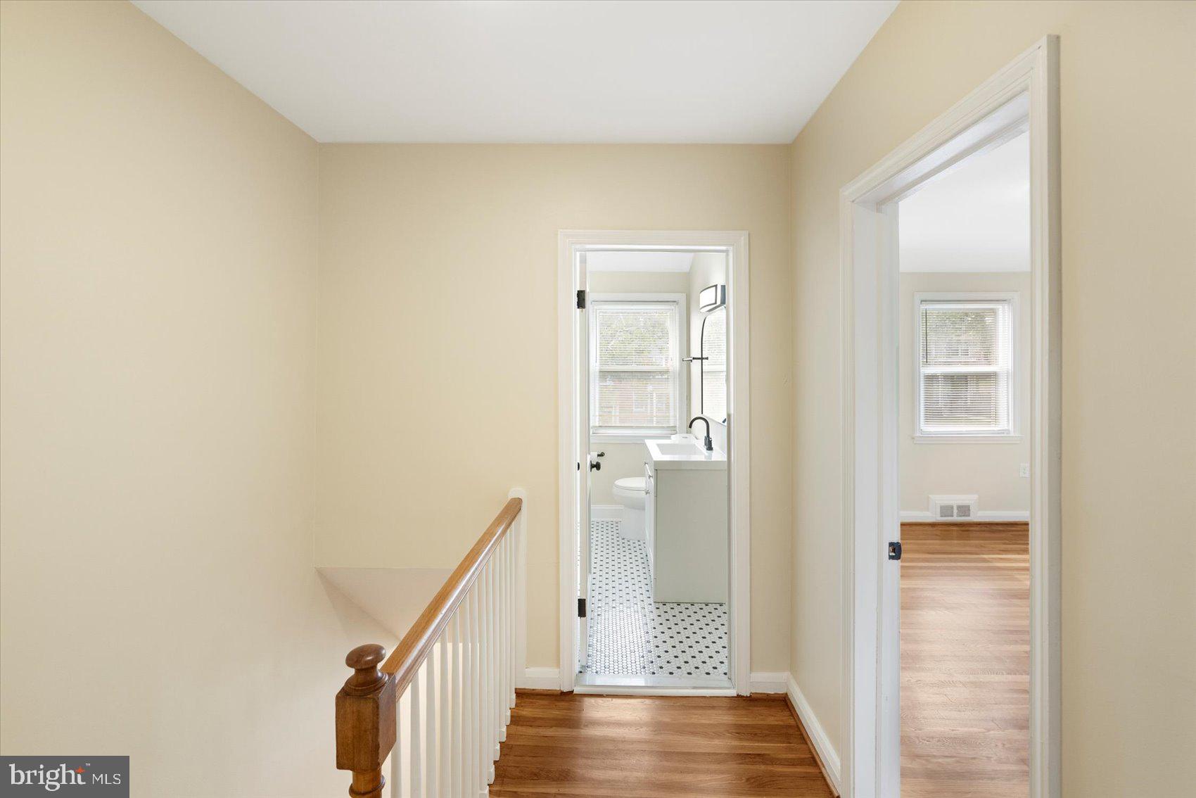 1444 Meridene Drive Baltimore, MD 21239 - Photo 28 of 36 a view of a hallway with wooden floor and entryway