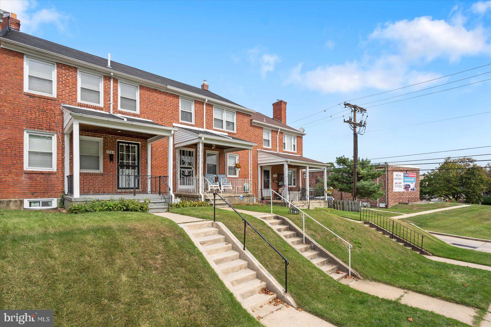 1444 Meridene Drive Baltimore, MD 21239 - Photo 3 of 36 a front view of a building with a garden