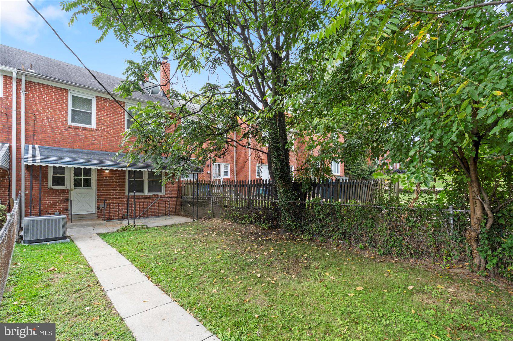 1444 Meridene Drive Baltimore, MD 21239 - Photo 35 of 36 a view of house with a yard