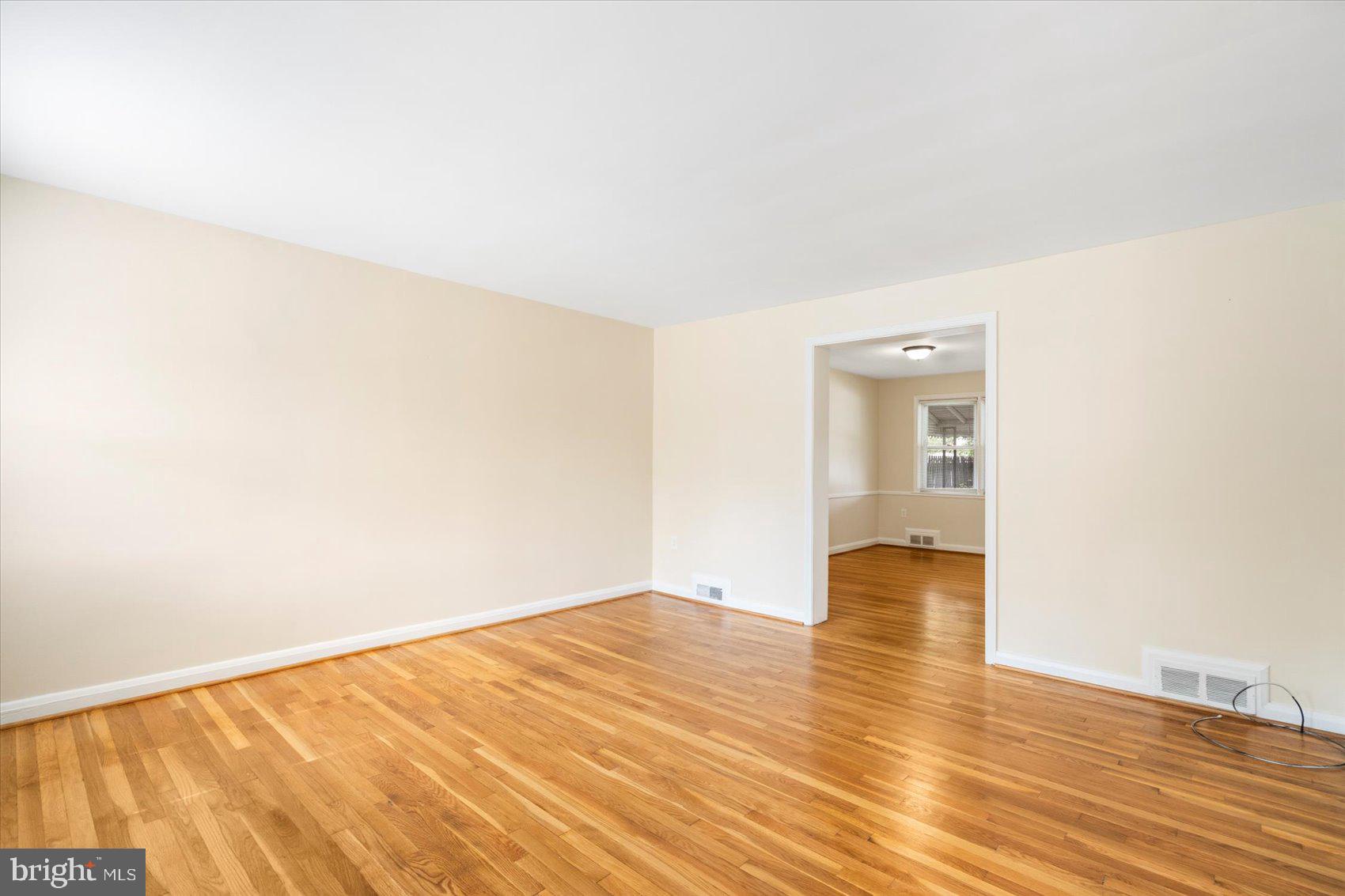 1444 Meridene Drive Baltimore, MD 21239 - Photo 4 of 36 a view of empty room with wooden floor