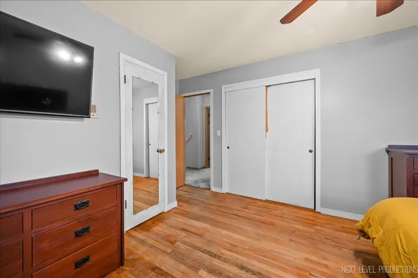 a view of room with wooden floor and chair