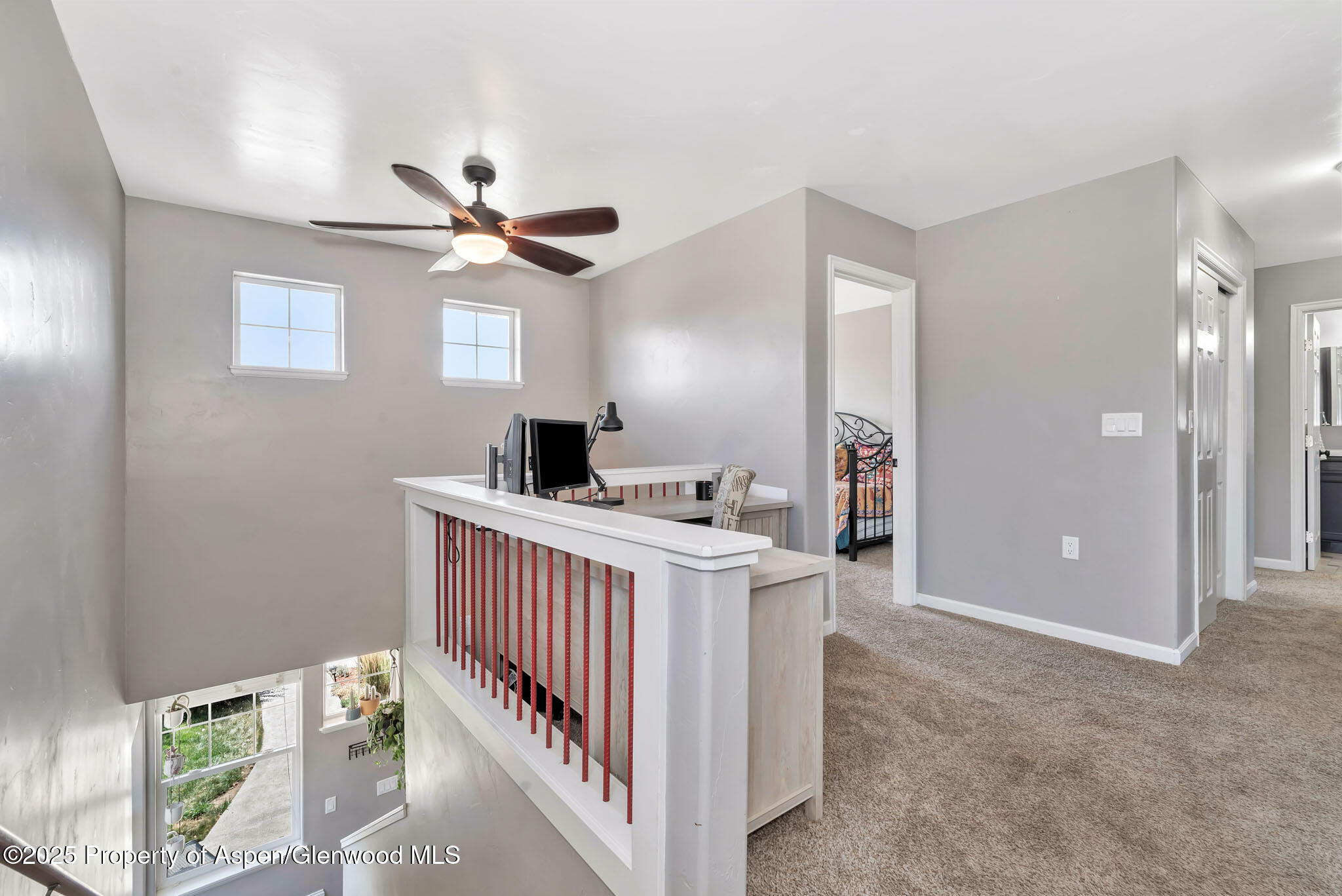 875 Dry Creek Road Hayden, CO 81639 - Photo 19 of 40 a view of a hallway to a livingroom with furniture