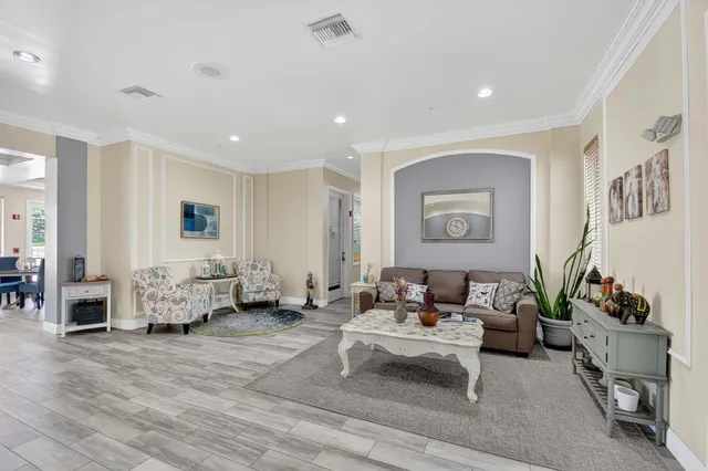 a bench sitting in a room next to a window