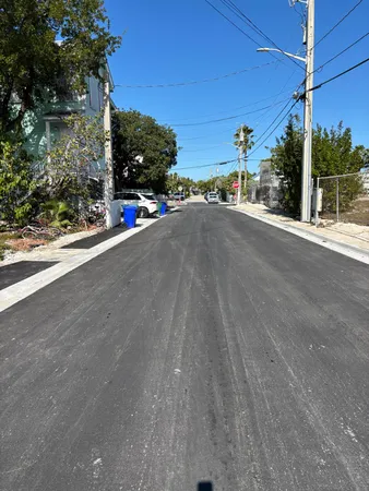 a view of a street with a building in the background