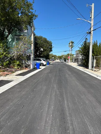 a view of a street with a building in the background