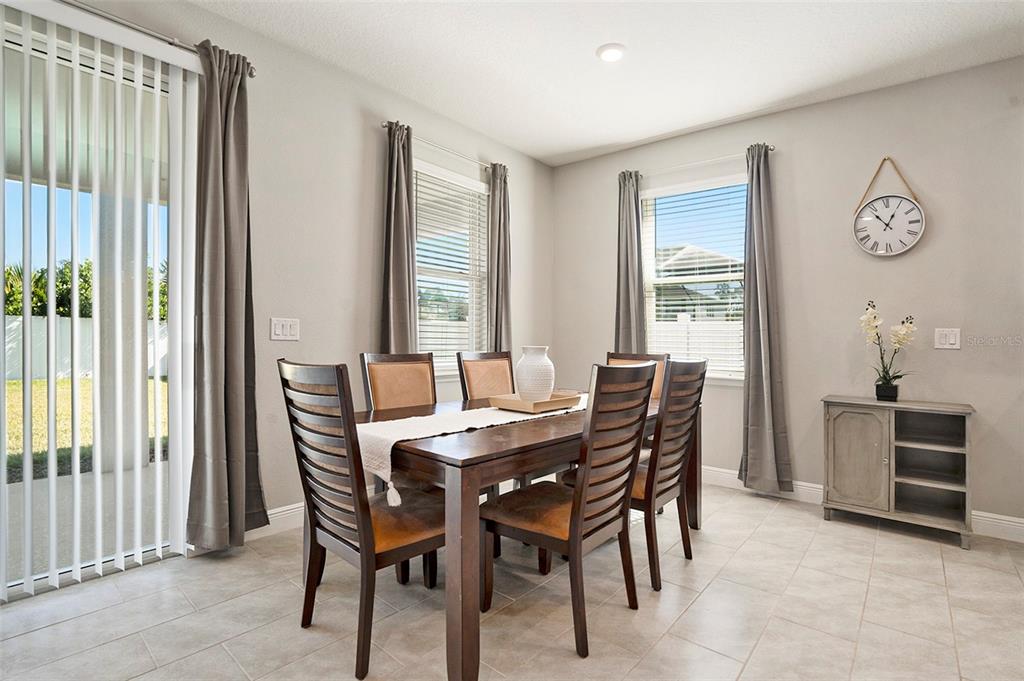 10903 Honor Road Tampa, FL 33625 - Photo 16 of 36 a dining room with furniture and window