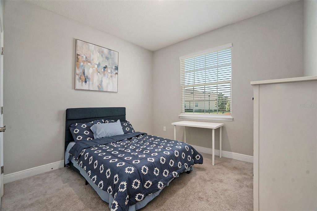 10903 Honor Road Tampa, FL 33625 - Photo 6 of 36 a bedroom with a bed and a window