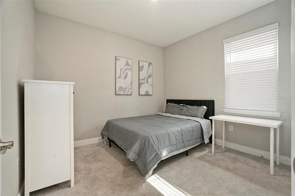 10903 Honor Road Tampa, FL 33625 - Photo 8 of 36 a bedroom with a bed and a window