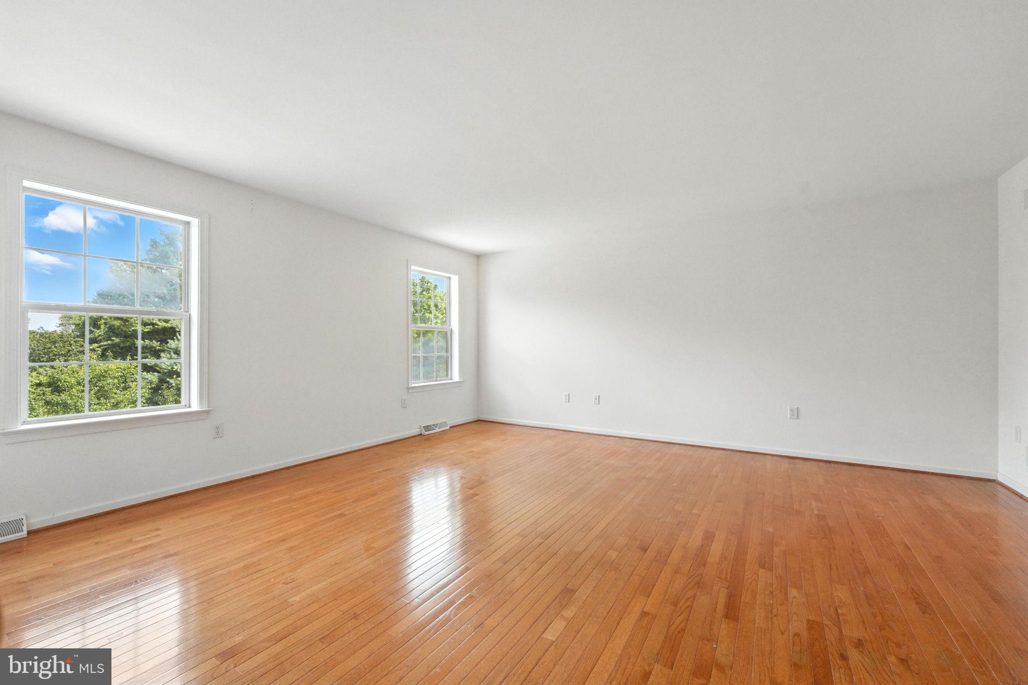 2 Radence Lane West Grove, PA 19390 - Photo 12 of 24 an empty room with wooden floor and windows