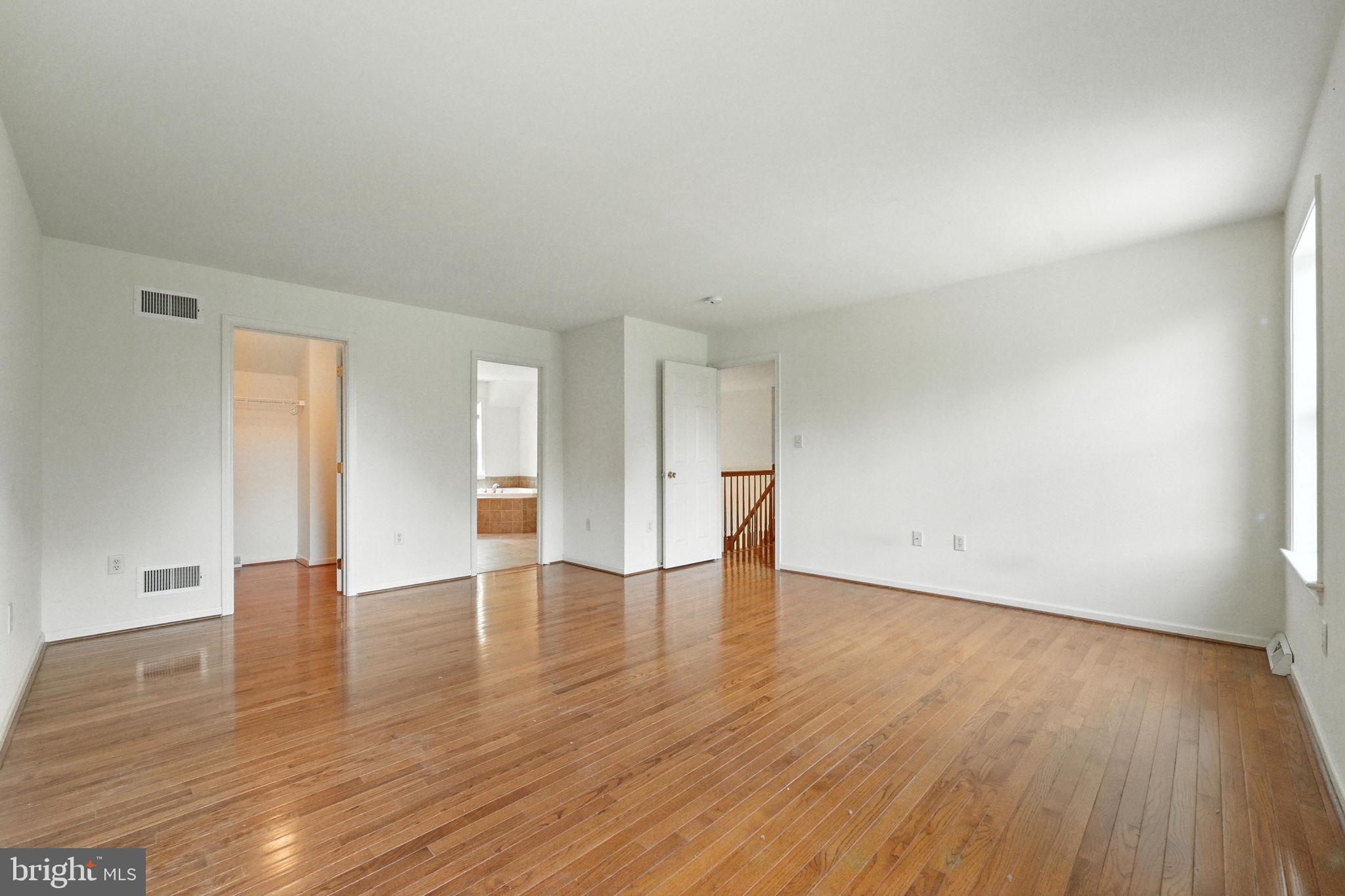 2 Radence Lane West Grove, PA 19390 - Photo 13 of 24 a view of an empty room with wooden floor and a window