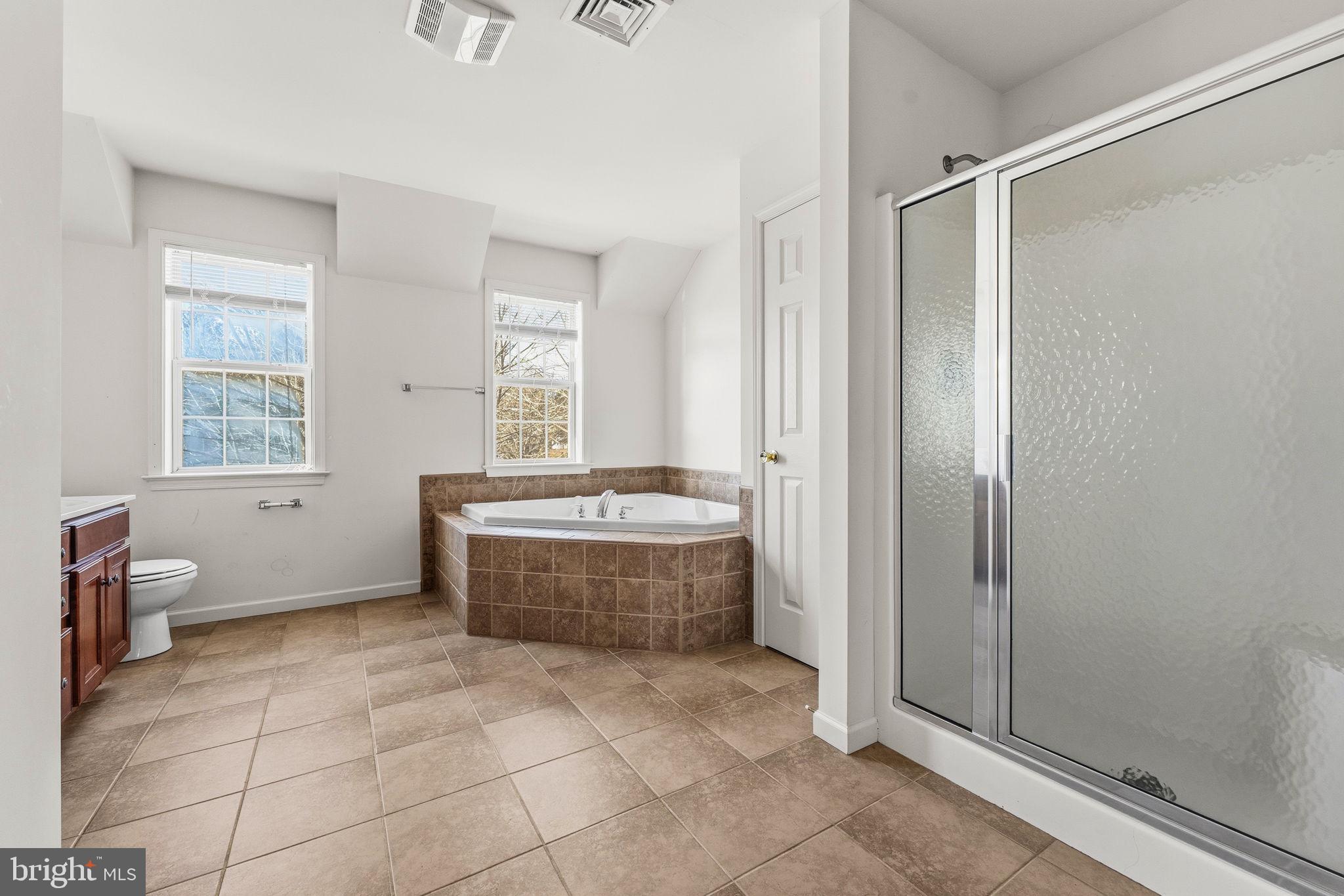 2 Radence Lane West Grove, PA 19390 - Photo 15 of 24 a bathroom with a tub sink and mirror