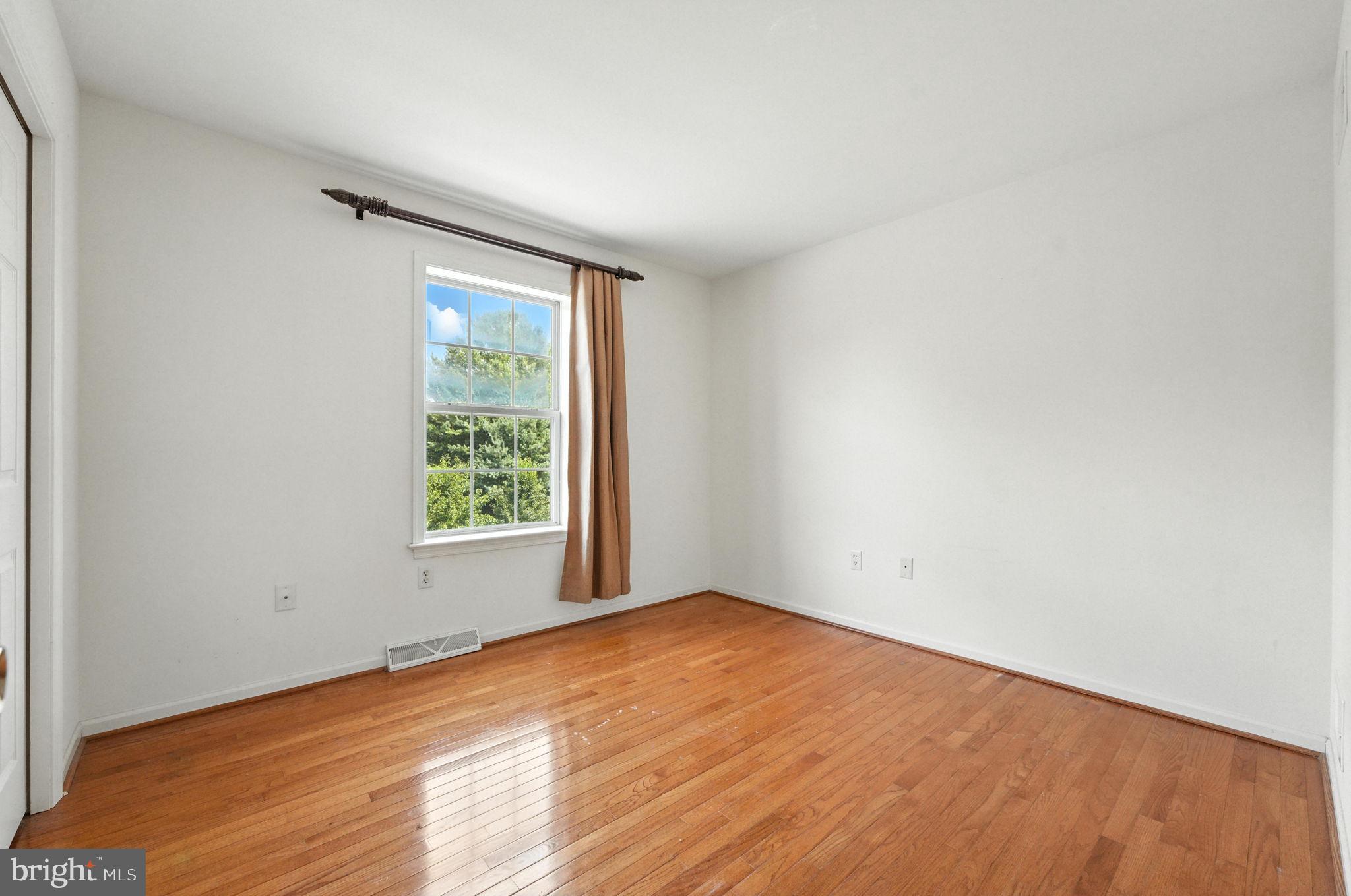 2 Radence Lane West Grove, PA 19390 - Photo 16 of 24 an empty room with wooden floor and windows