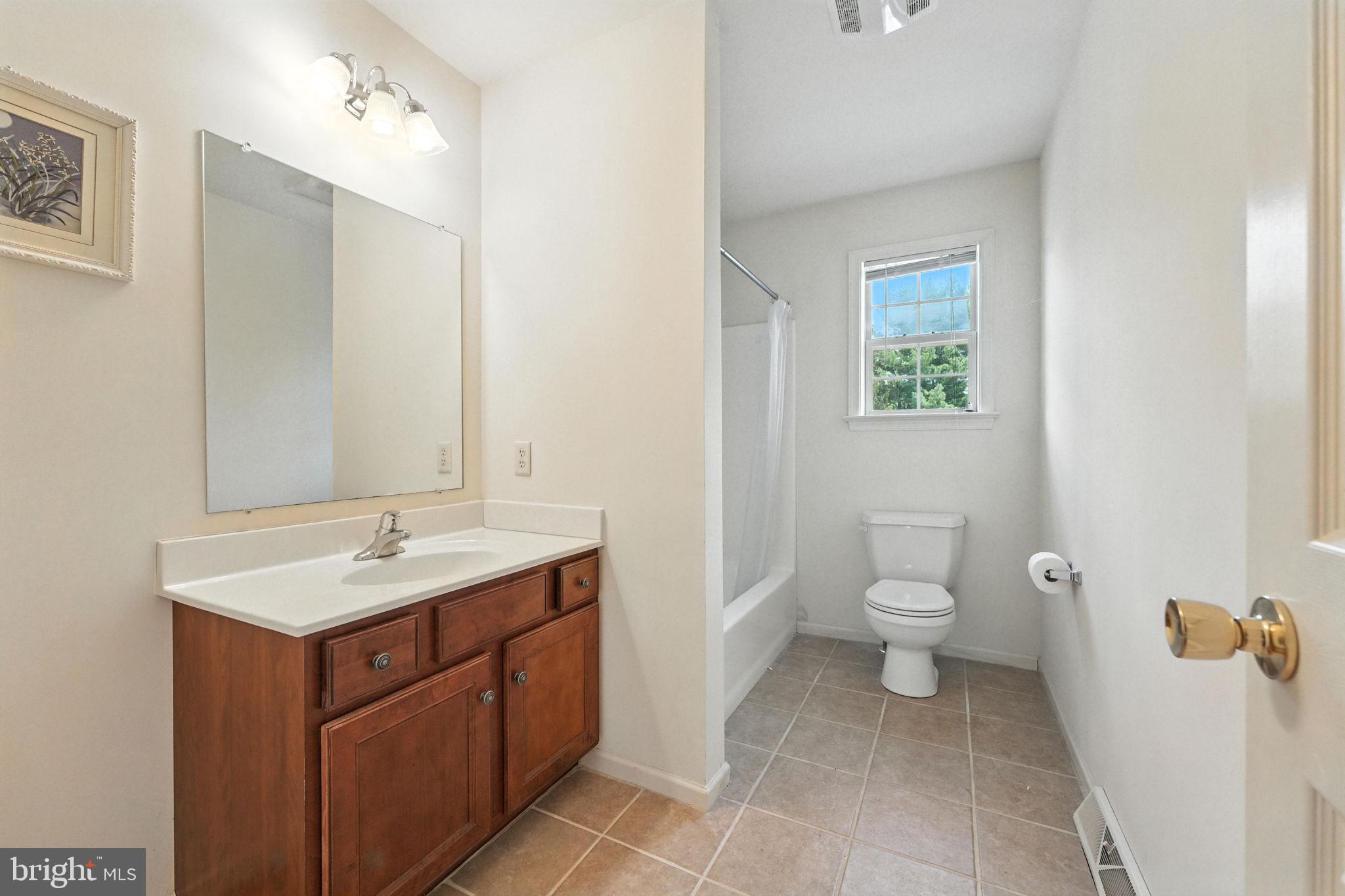 2 Radence Lane West Grove, PA 19390 - Photo 19 of 24 a spacious bathroom with a toilet sink and mirror
