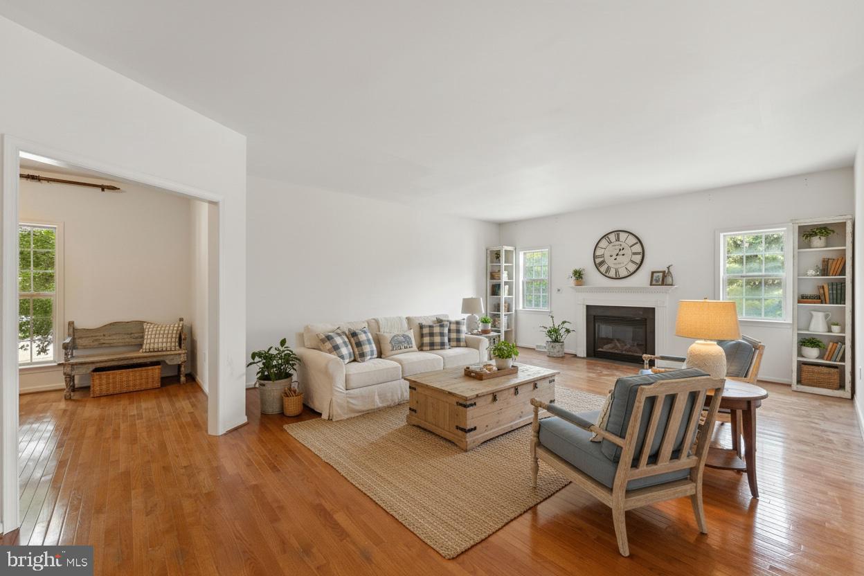 2 Radence Lane West Grove, PA 19390 - Photo 3 of 24 a living room with fireplace furniture and a wooden floor
