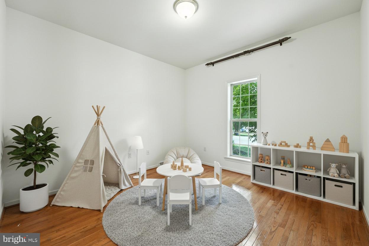 2 Radence Lane West Grove, PA 19390 - Photo 10 of 24 a dining room with furniture potted plants and wooden floor