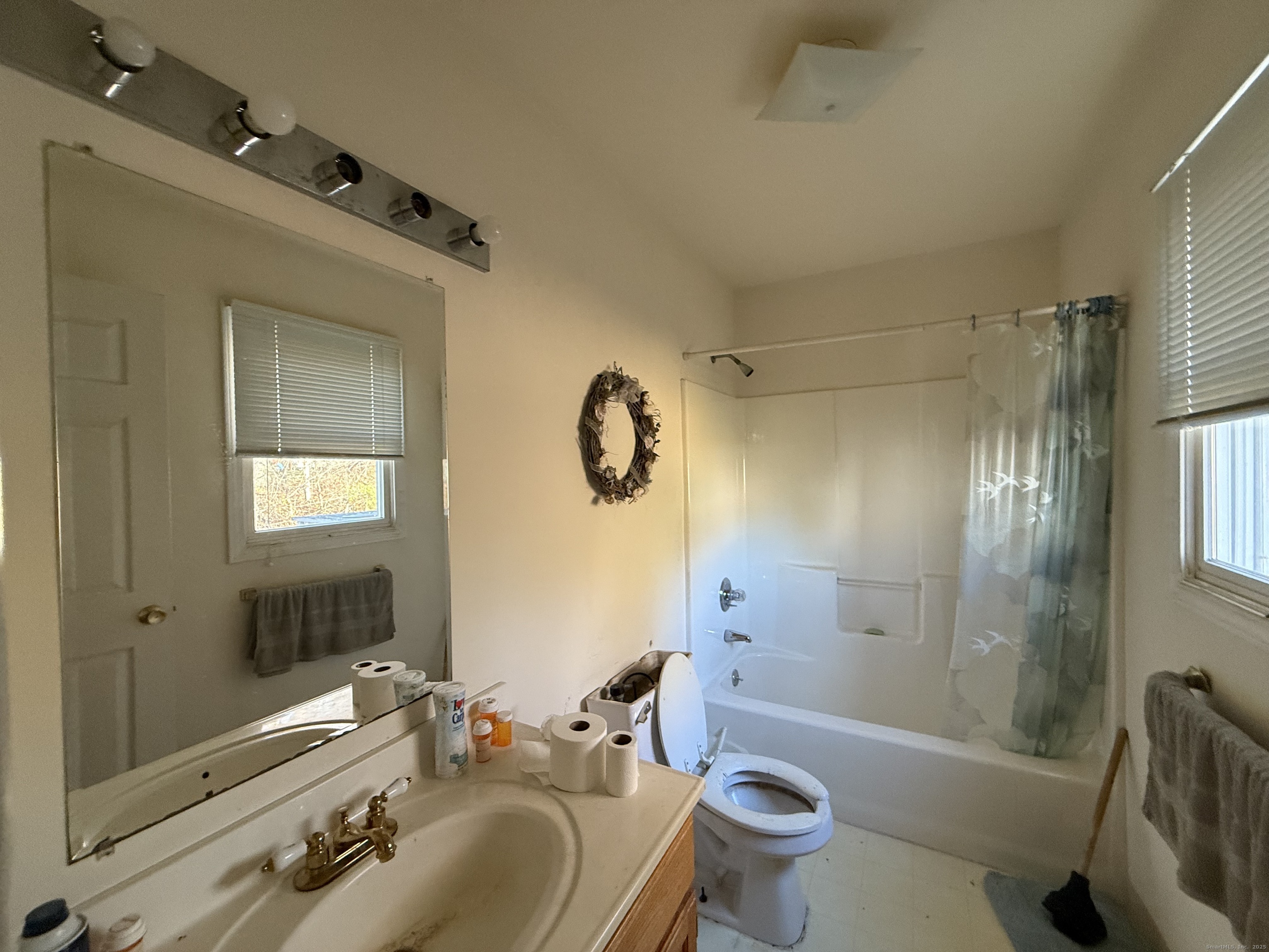 18 Ridgebury Drive Trumbull, CT 06611 - Photo 4 of 21 a bathroom with a sink a toilet and shower