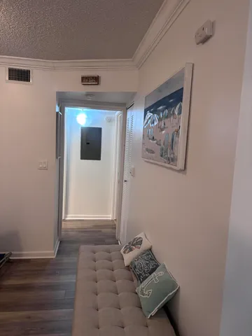 a room with wooden floor and a window