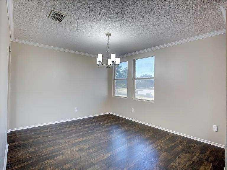 1033 Burnet Drive Mesquite, TX 75181 - Photo 20 of 21 a view of livingroom with chandelier fan and wooden floor