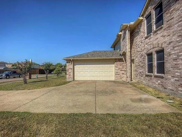 a view of a house with a street
