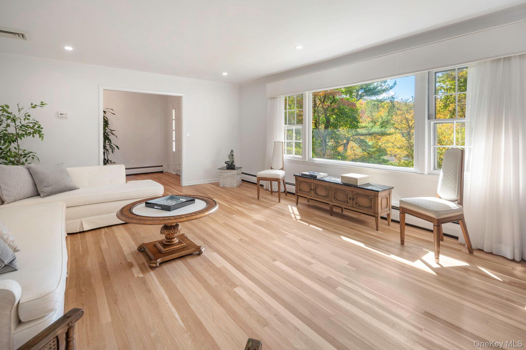 111 Seven Bridges Road Chappaqua, NY 10514 - Photo 11 of 29 a living room with furniture and a wooden floor