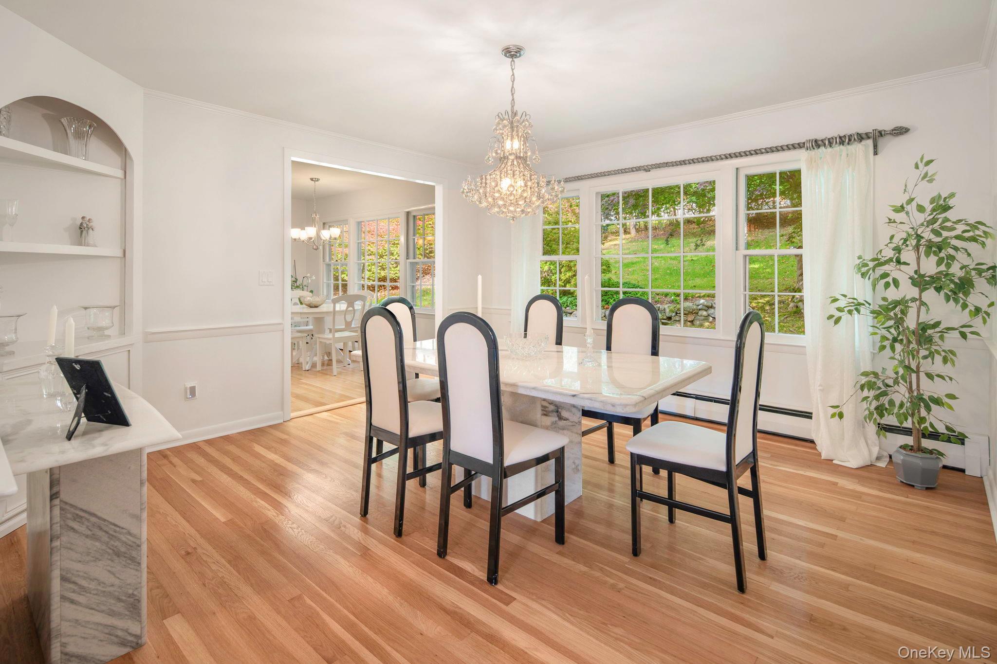 111 Seven Bridges Road Chappaqua, NY 10514 - Photo 13 of 29 a view of a dining room with furniture window and wooden floor