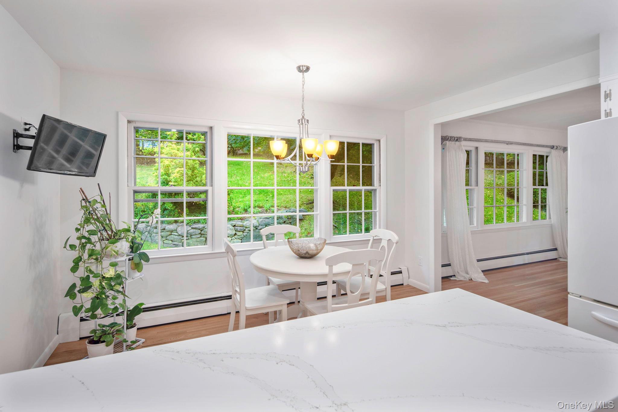 111 Seven Bridges Road Chappaqua, NY 10514 - Photo 16 of 29 a bedroom with furniture and large windows