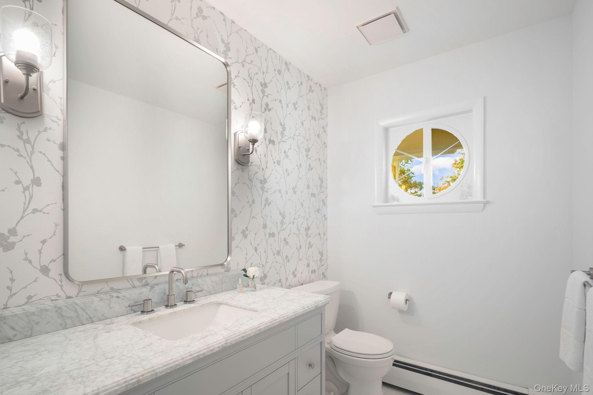111 Seven Bridges Road Chappaqua, NY 10514 - Photo 19 of 29 a bathroom with a granite countertop sink toilet and a mirror