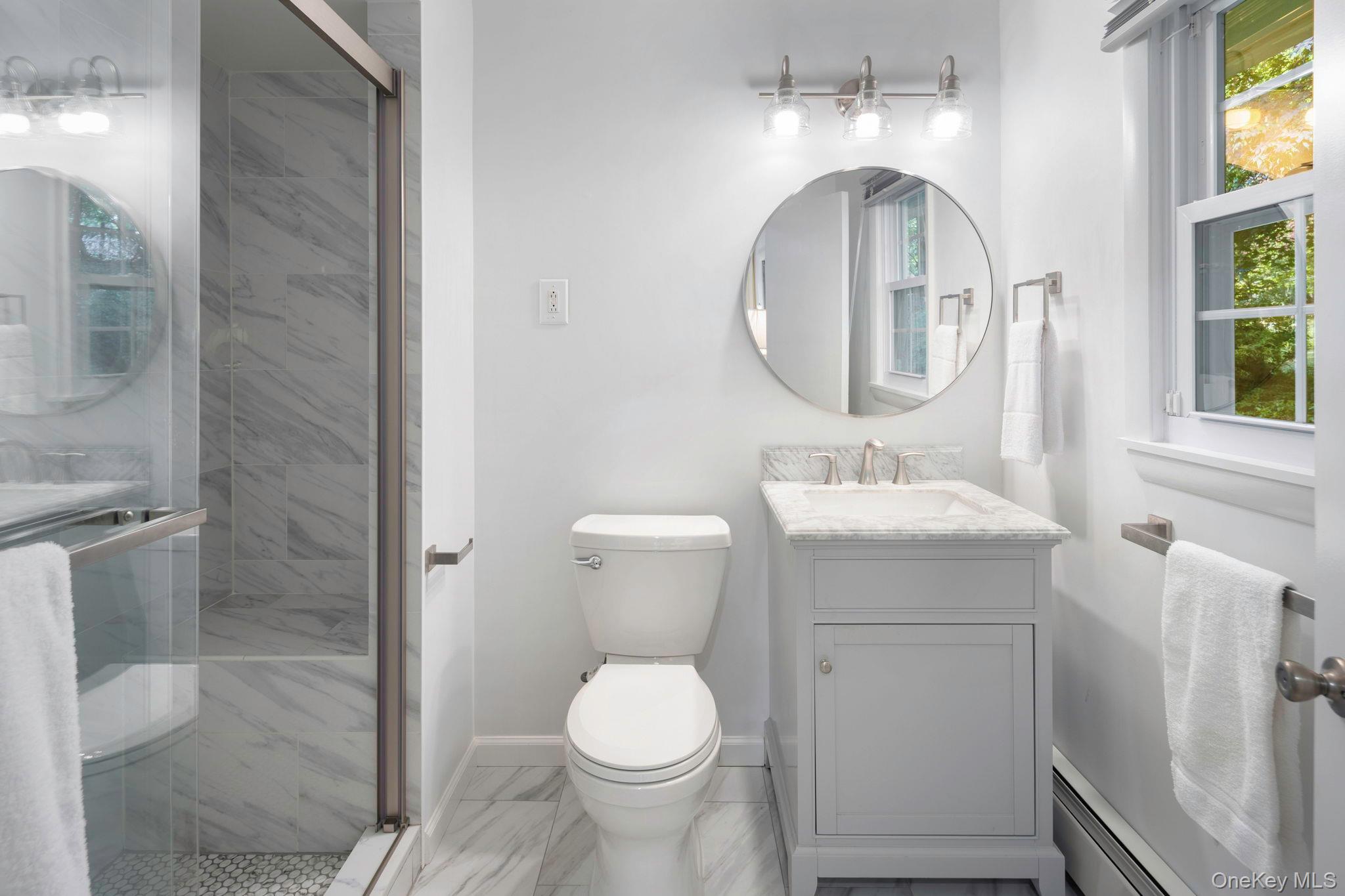 111 Seven Bridges Road Chappaqua, NY 10514 - Photo 23 of 29 a bathroom with a toilet sink and mirror