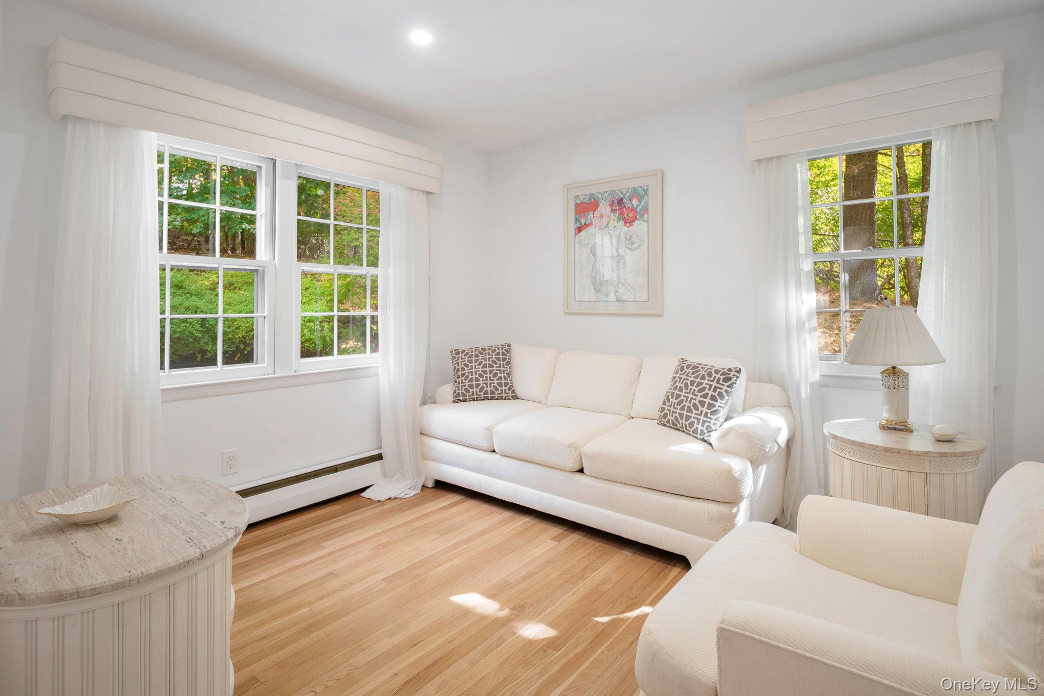 111 Seven Bridges Road Chappaqua, NY 10514 - Photo 24 of 29 a living room with furniture and windows