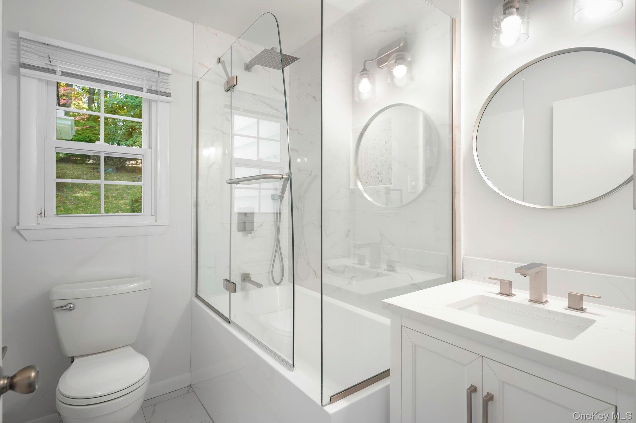 111 Seven Bridges Road Chappaqua, NY 10514 - Photo 27 of 29 a bathroom with a sink a toilet and shower