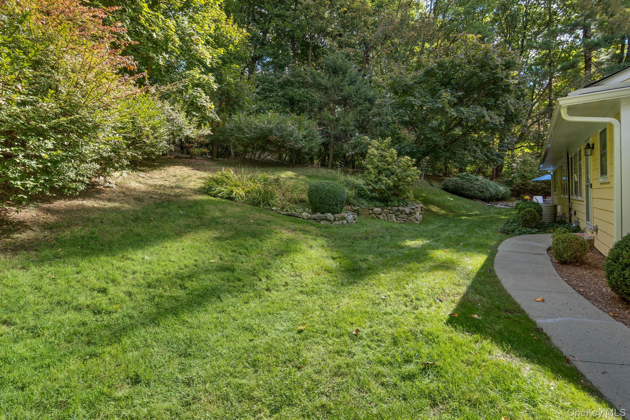 111 Seven Bridges Road Chappaqua, NY 10514 - Photo 7 of 29 a view of backyard with green space