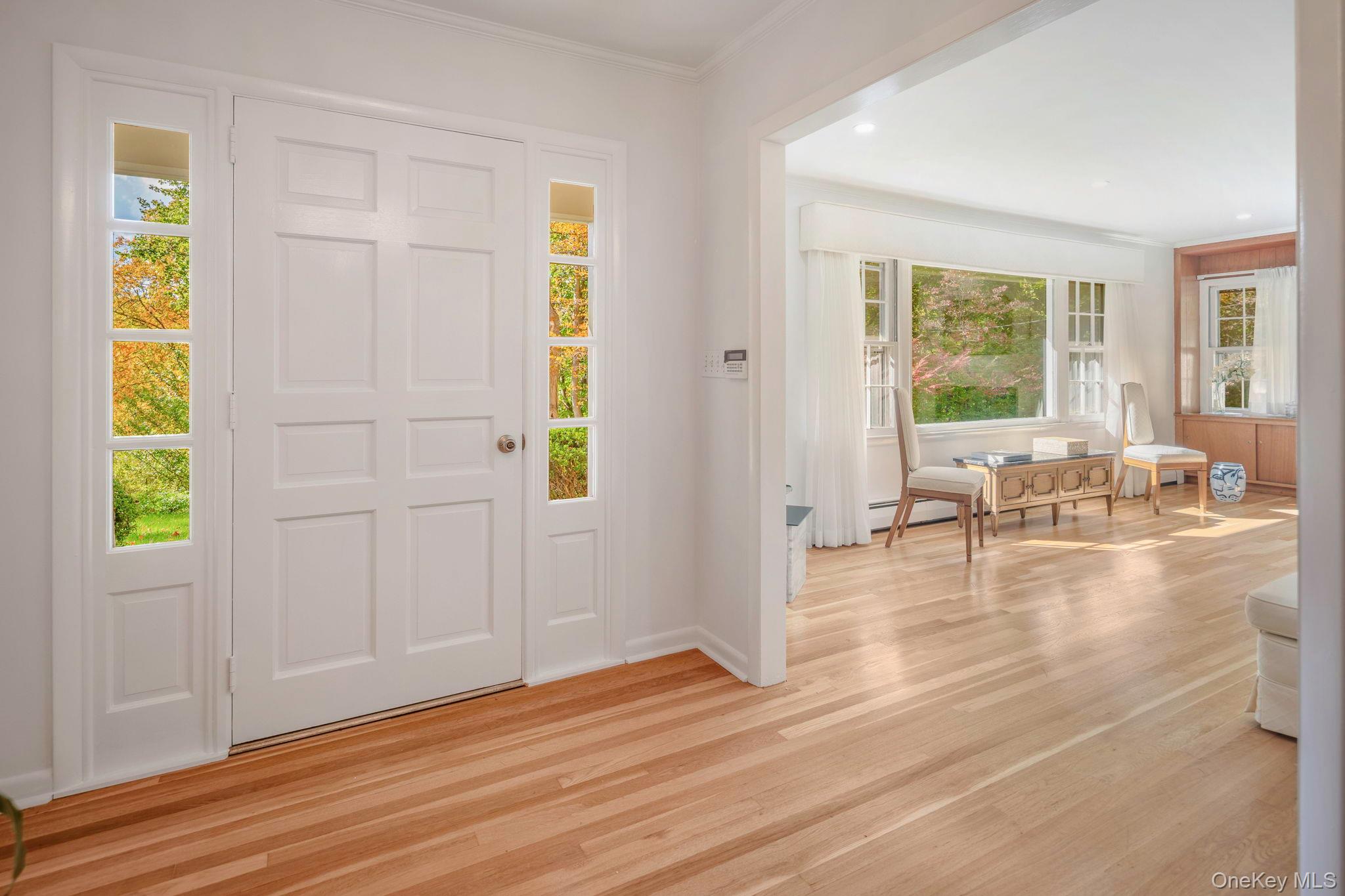 111 Seven Bridges Road Chappaqua, NY 10514 - Photo 8 of 29 a view of an empty room with wooden floor and a window