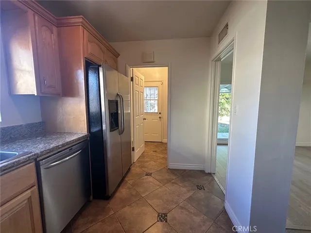 a view of a kitchen from the hallway