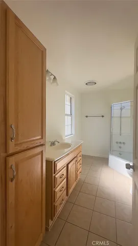a view of a kitchen with an empty space and a window