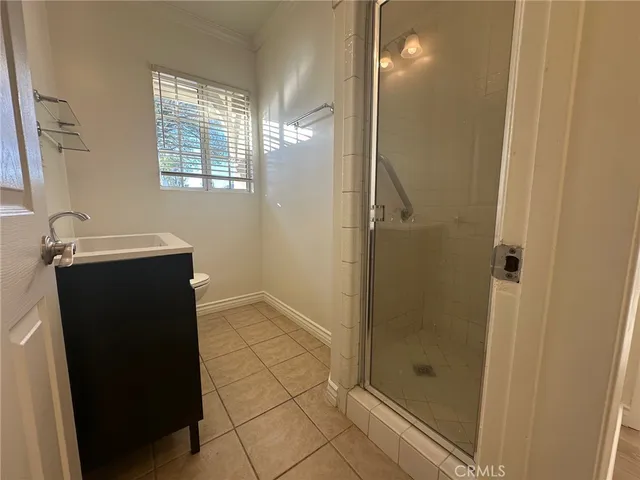 a bathroom with a shower and a mirror