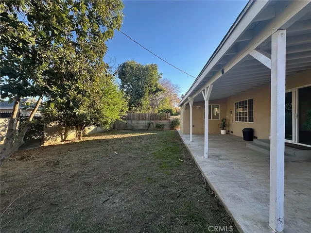 a view of a house with a tree
