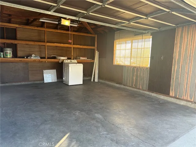 a view of a room with wooden walls