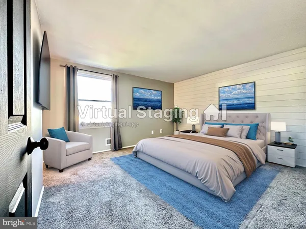 a spacious bedroom with a large bed and a couch