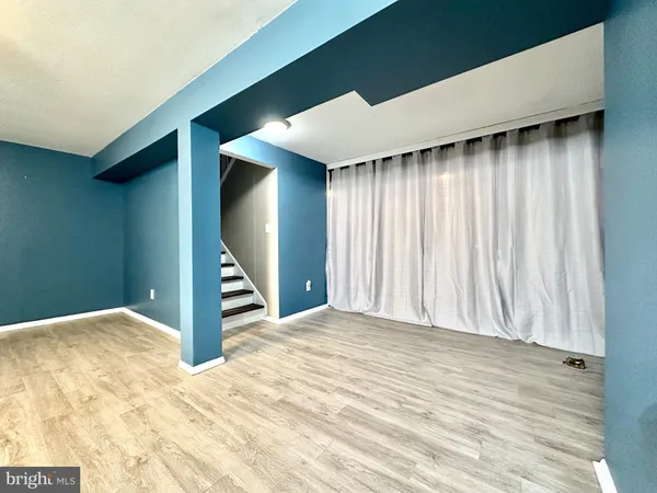 a view of an empty room with a fireplace