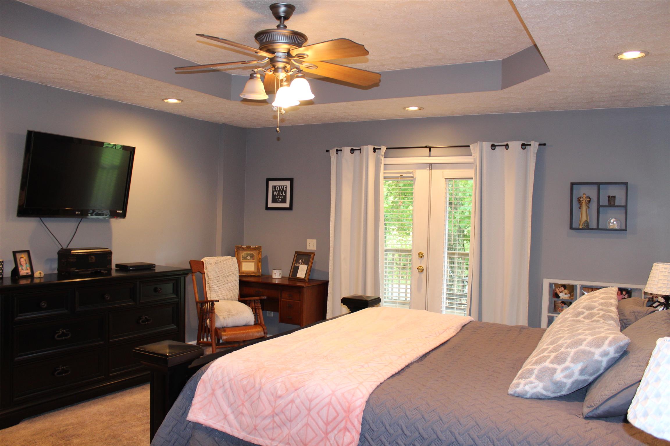 7052 Hall Road Greenbrier, TN 37073 - Photo 16 of 29 a bedroom with a bed and a flat screen tv
