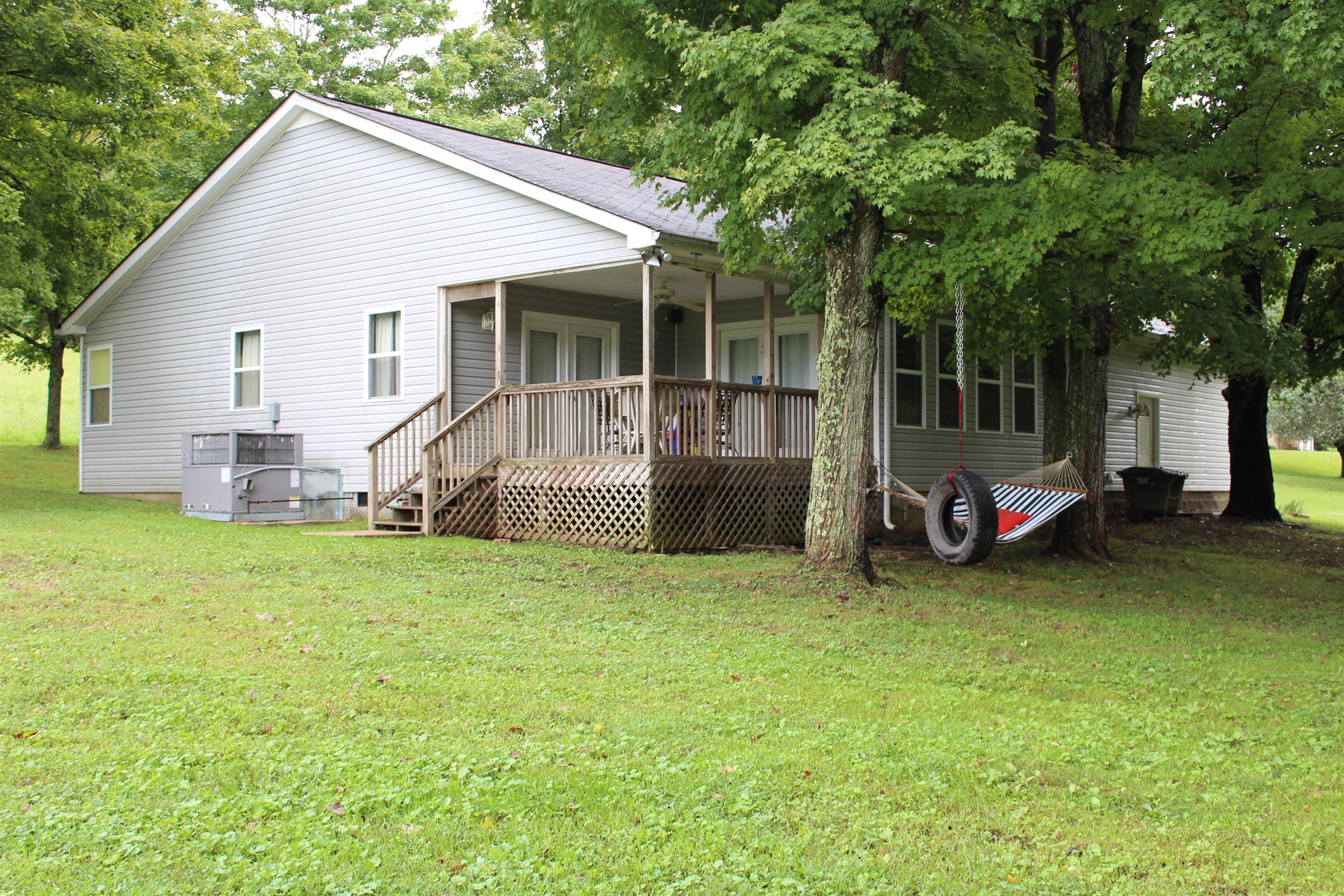 7052 Hall Road Greenbrier, TN 37073 - Photo 3 of 29 a view of a house with backyard and porch