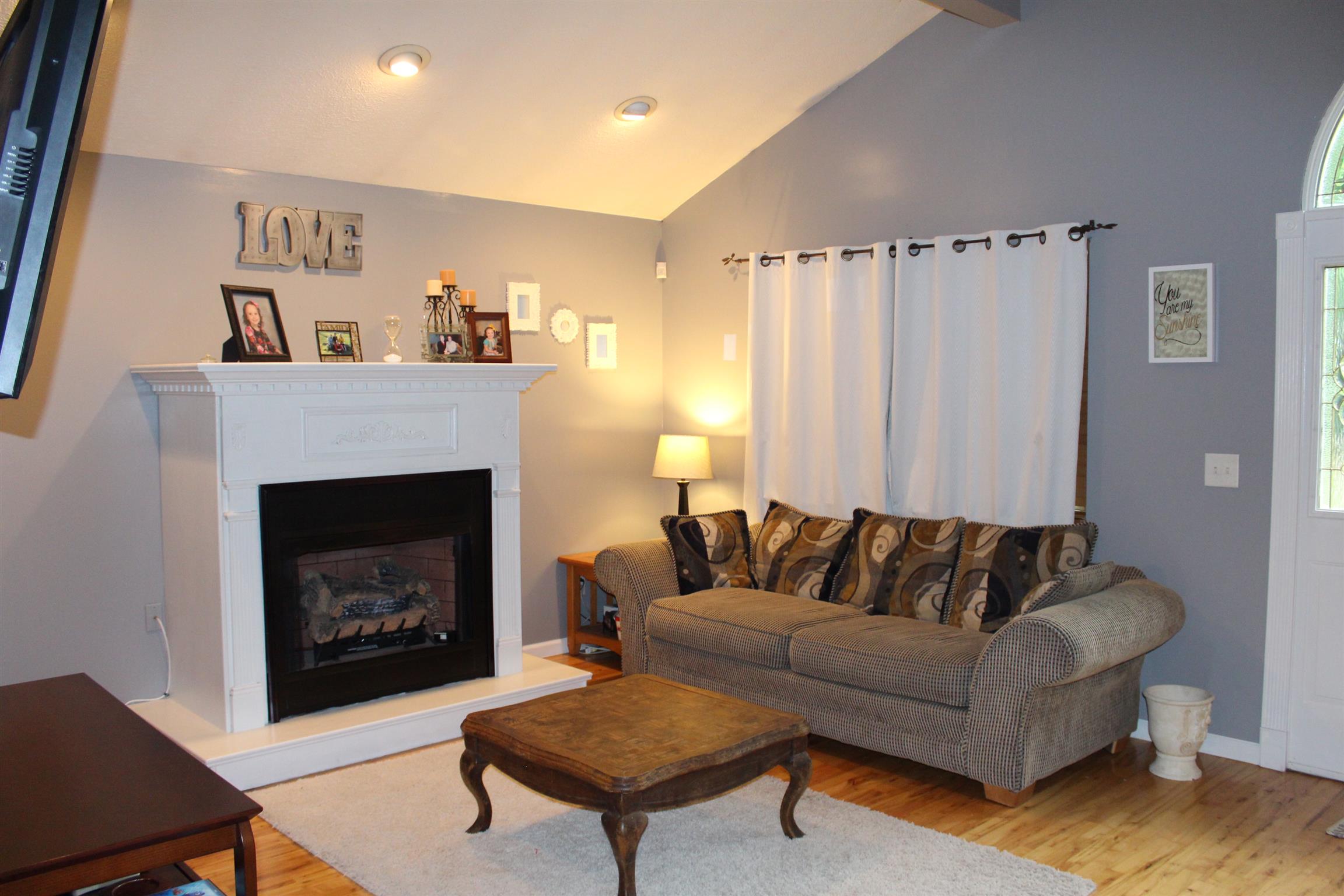 7052 Hall Road Greenbrier, TN 37073 - Photo 7 of 29 a living room with furniture and a fireplace