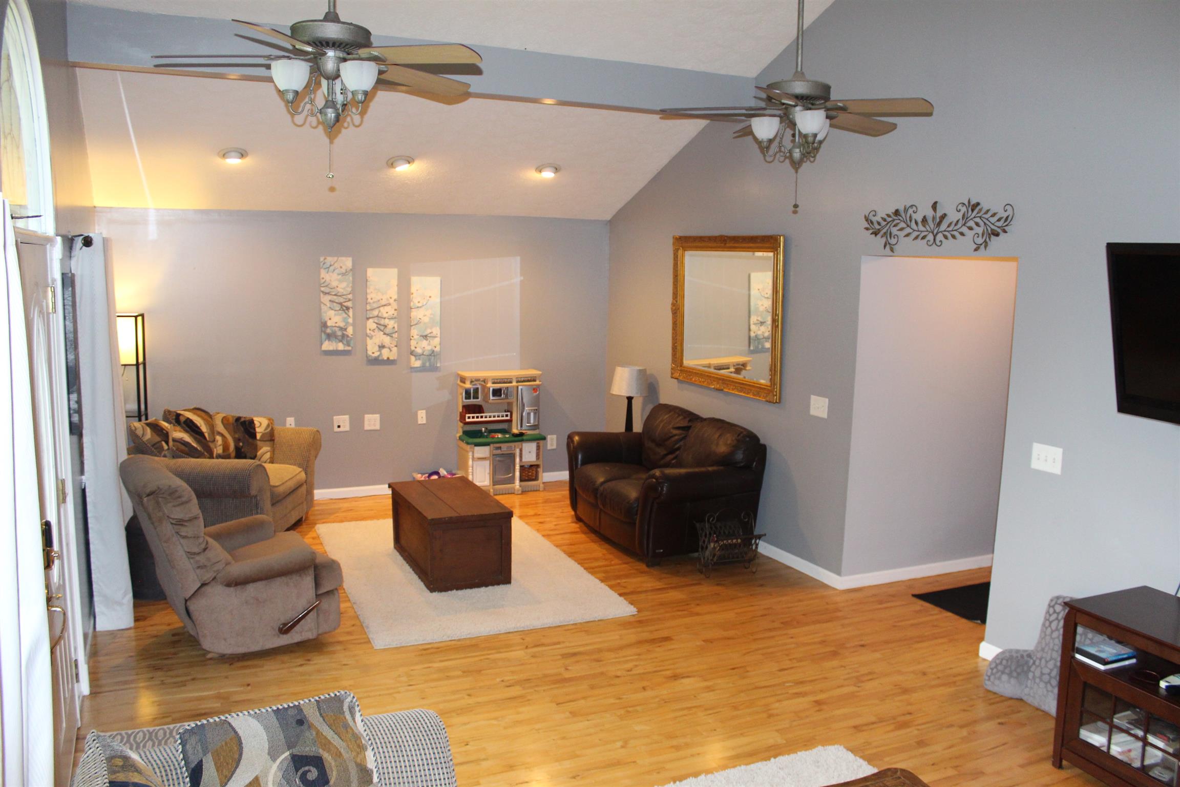 7052 Hall Road Greenbrier, TN 37073 - Photo 9 of 29 a living room with furniture and a flat screen tv