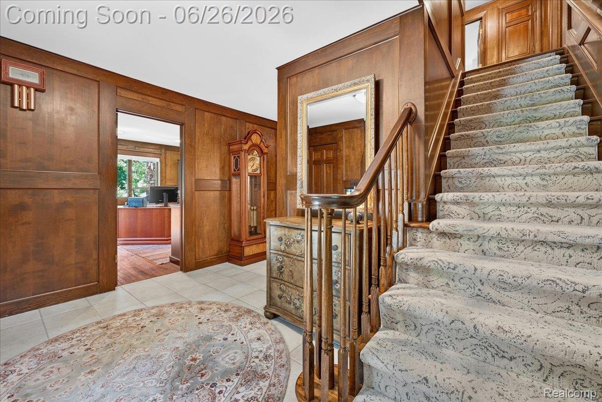 29498 East River Road Grosse Ile, MI 48138 - Photo 5 of 66 Wood Paneled Foyer with view to Office and Stairway
