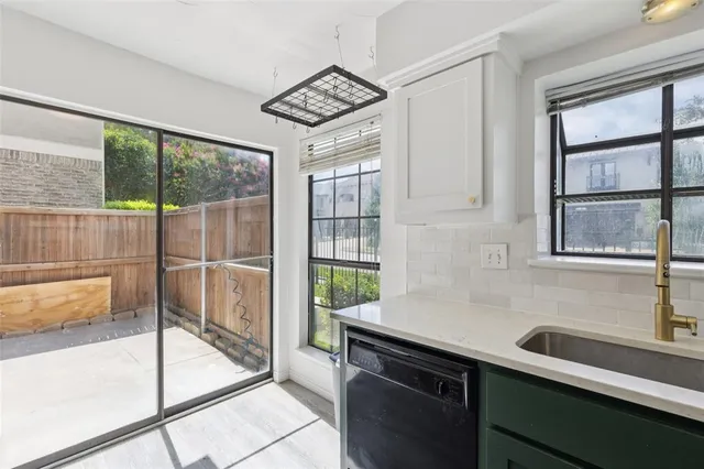 a view of a sink and a window