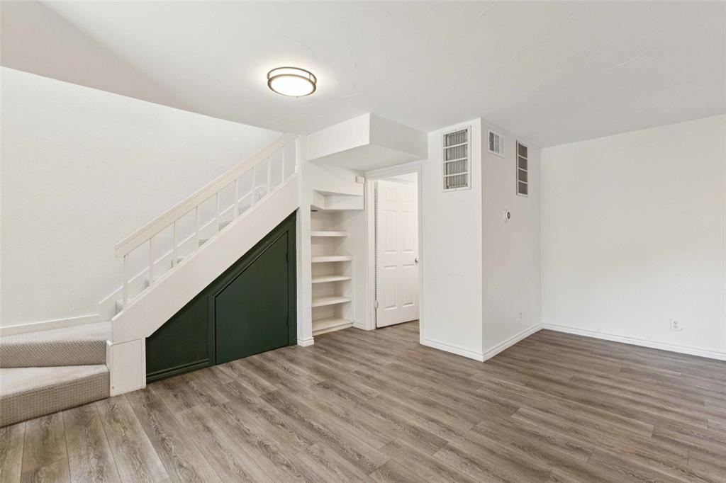 5200 Martel Avenue, Unit 36A Dallas, TX 75206 - Photo 12 of 34 a view of empty room with wooden floor